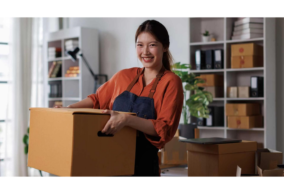 Team member packing wholesale orders for shipping
